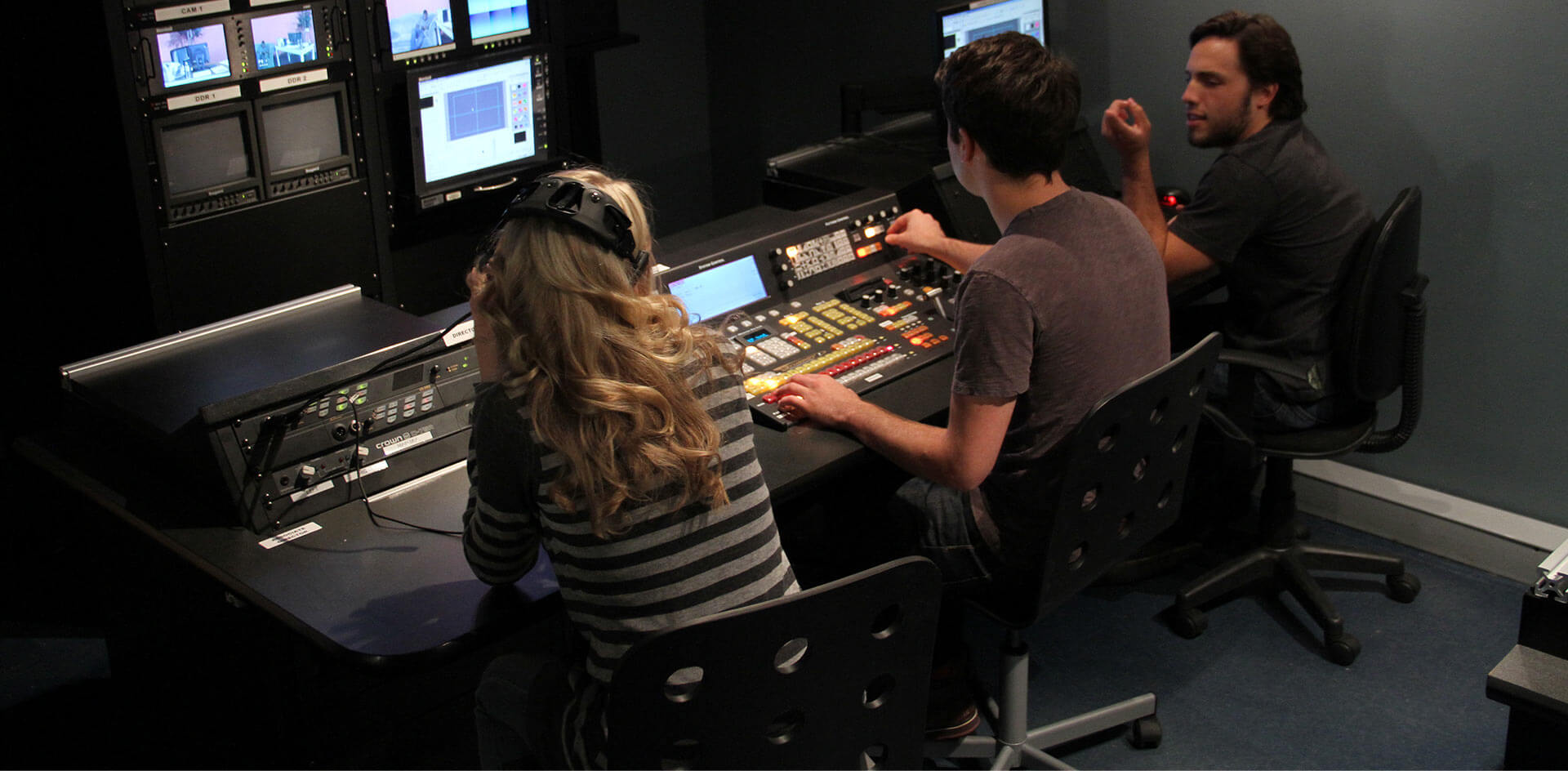 three people at a control board