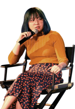 Cheyenne Tan sitting in a chair speaking into a microphone