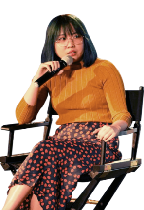 Cheyenne Tan sitting in a chair speaking into a microphone